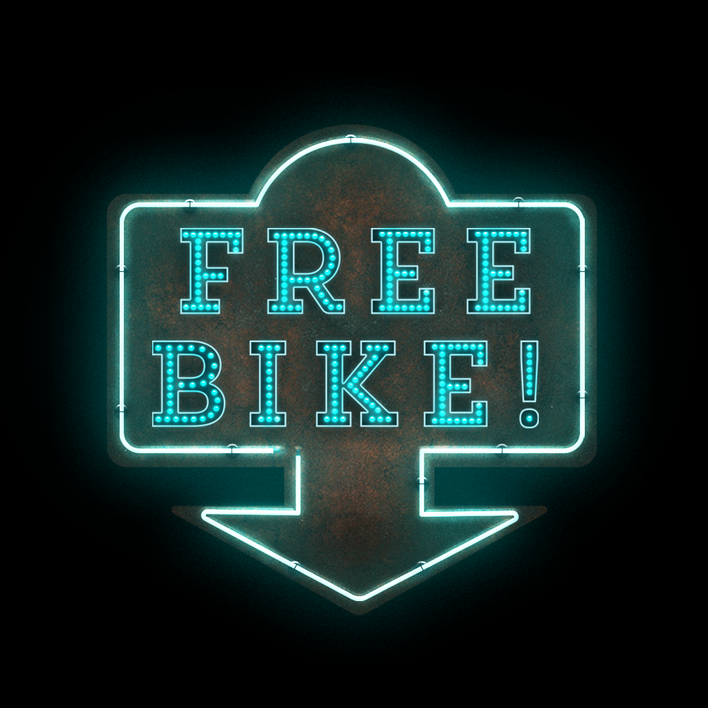 a neon light that reads 'free bike'