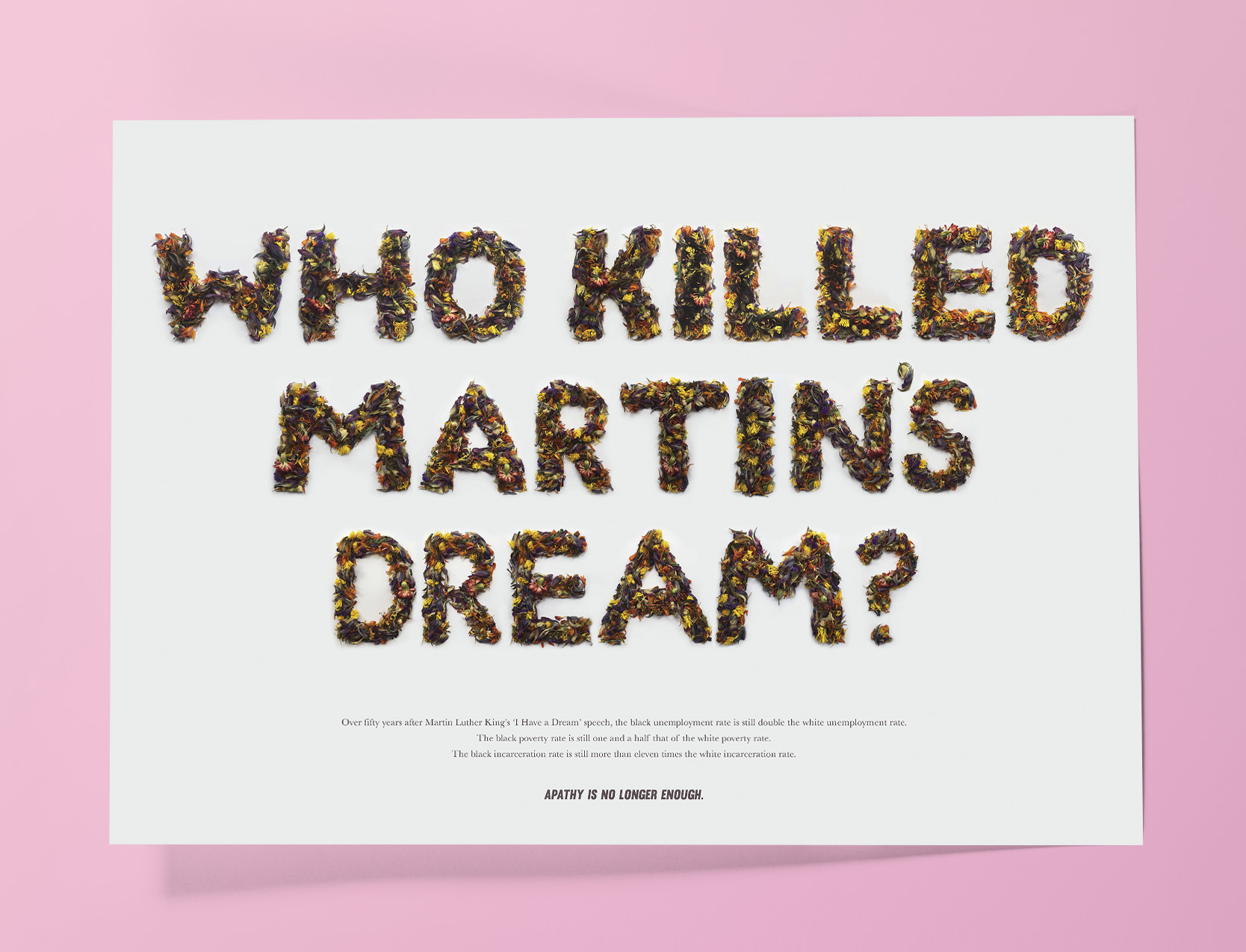 the words 'who killed martin's dream?' spelt out in dead flowers