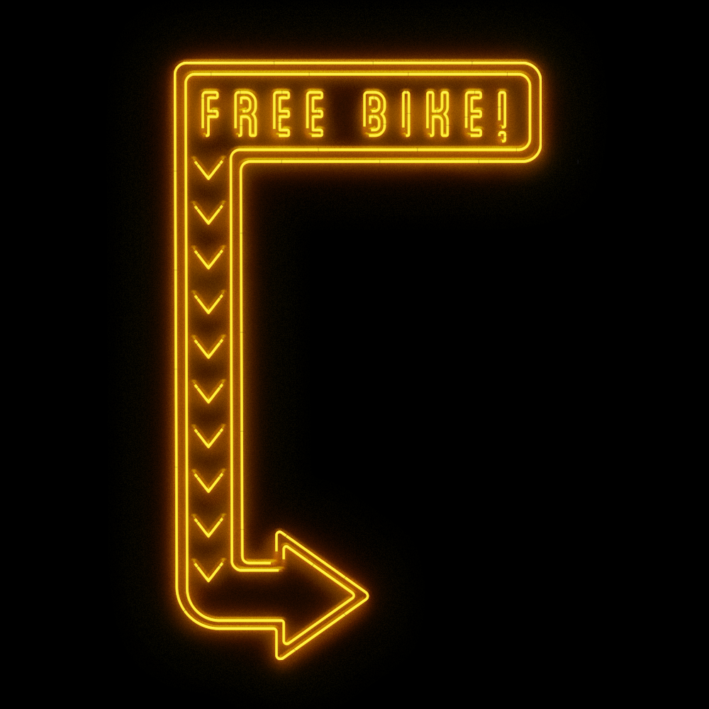 a neon light that reads 'free bike'