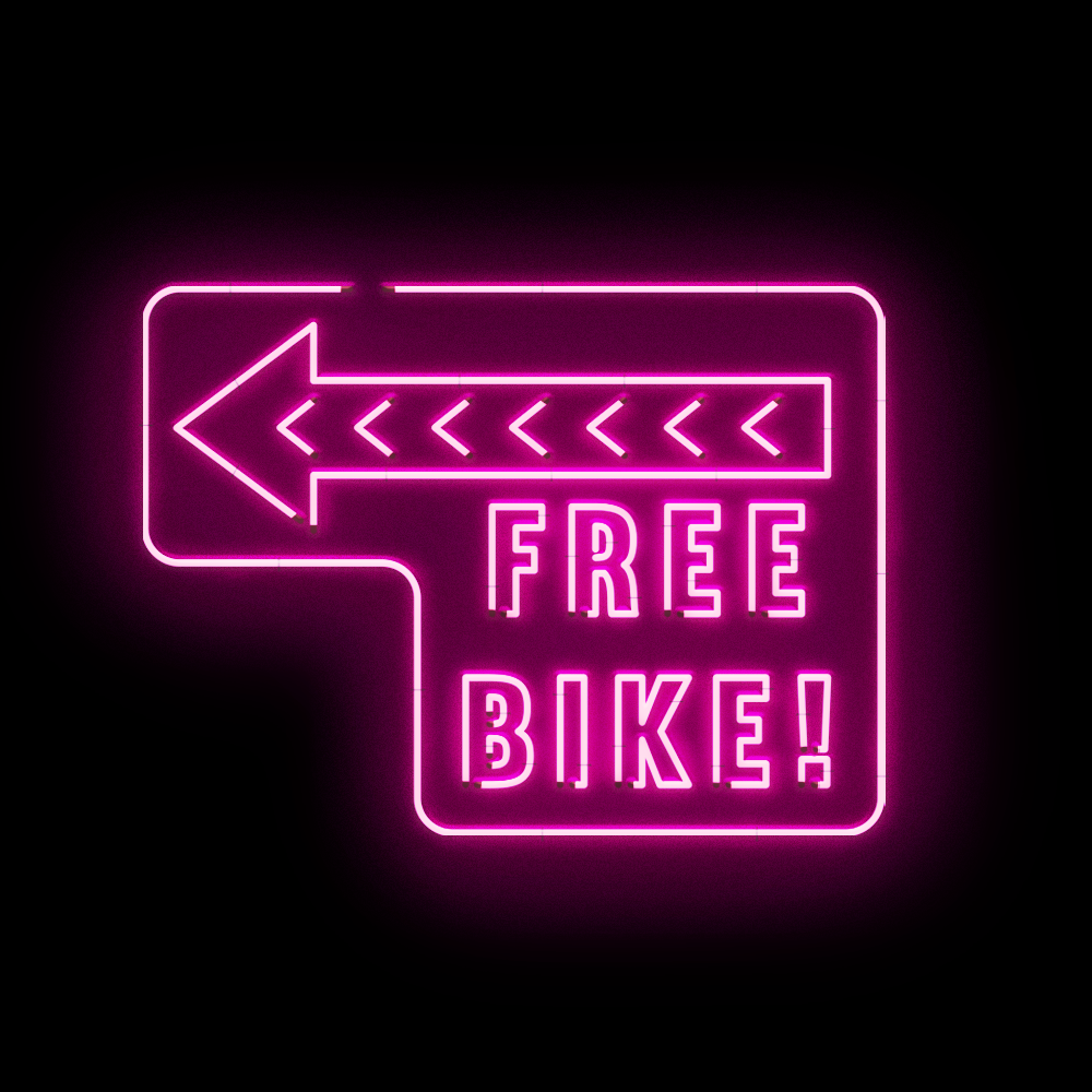 a neon sign reading 'free bike'